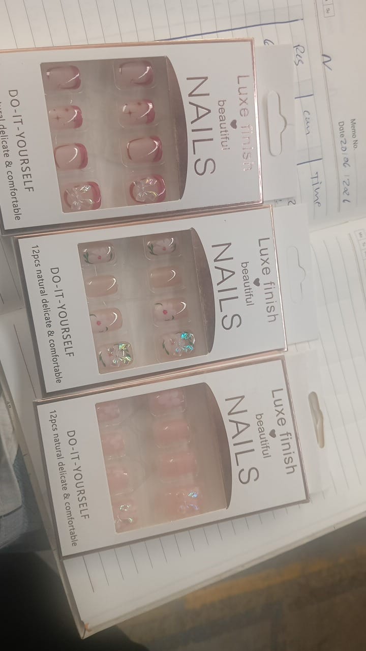 Reusable press-on nails set, assorted clear, pink, and iridescent false nail tips