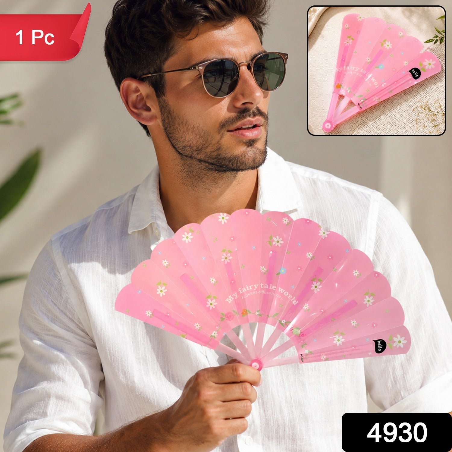 Pink floral foldable hand fan held open, lightweight pocket portable design