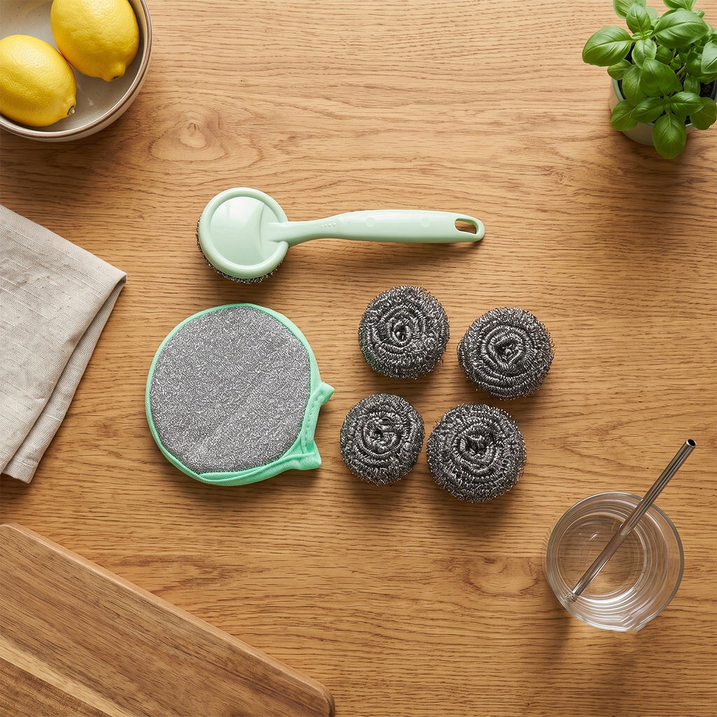 Stainless steel scrubber set with mint handle, large gray pad, and four gray metal balls