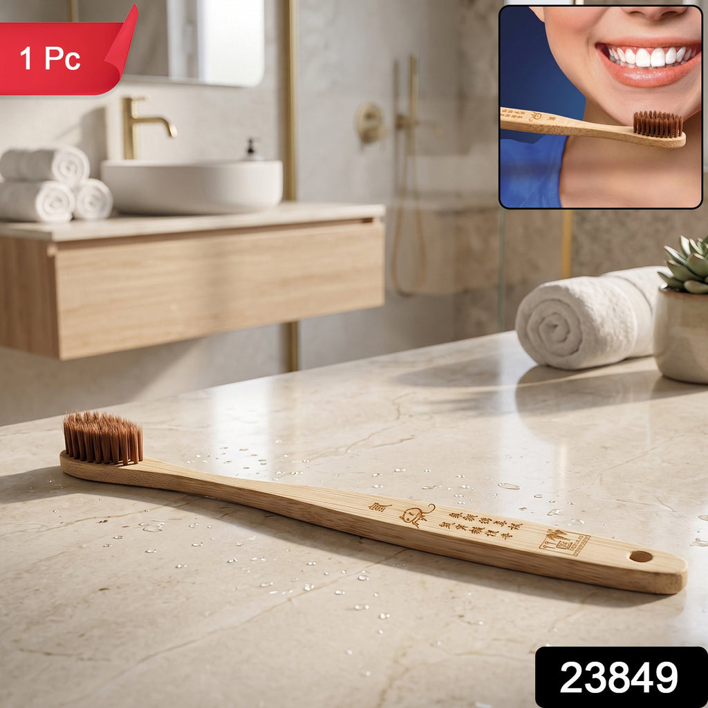 Bamboo toothbrush with soft brown bristles and engraved wooden handle, end hole