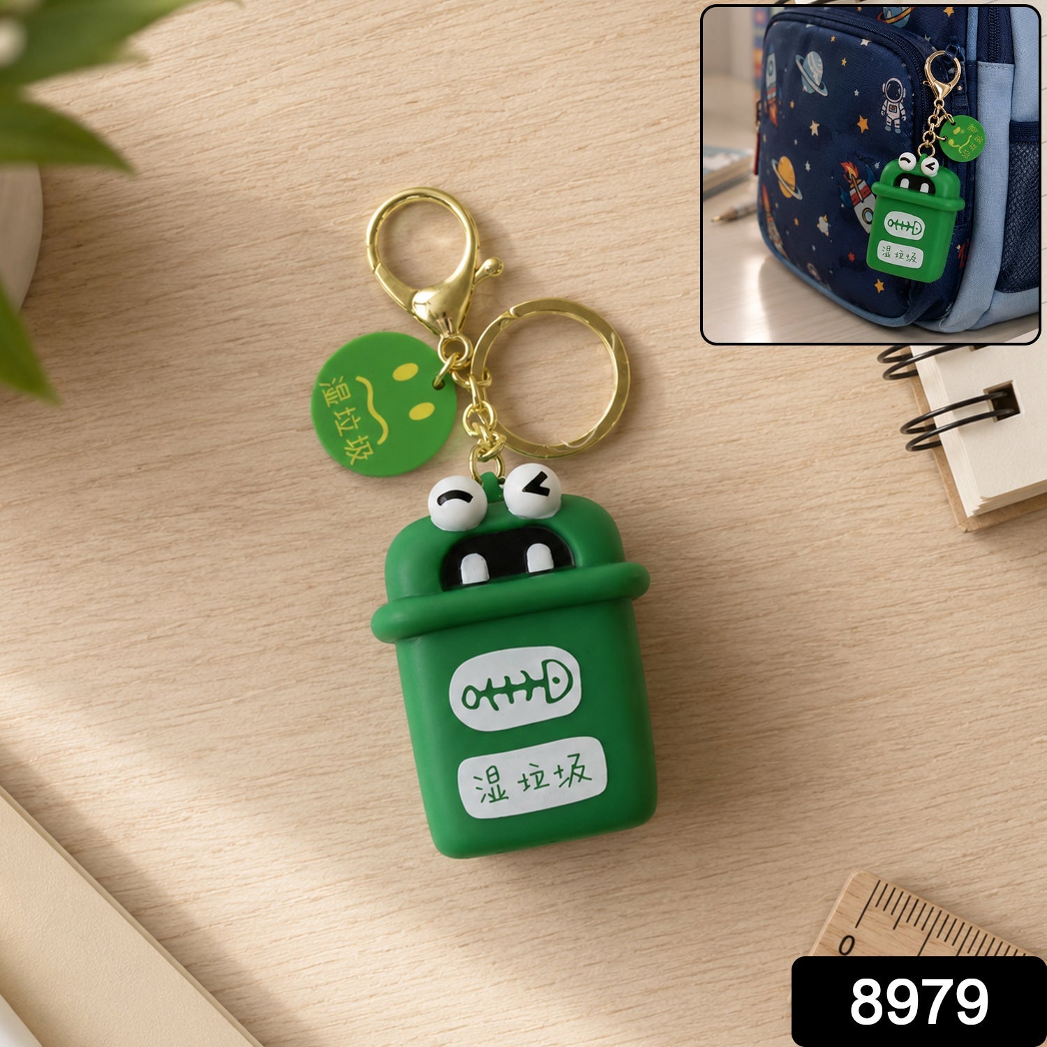 Green mini trash can keychain charm with cartoon face, gold rings and chain