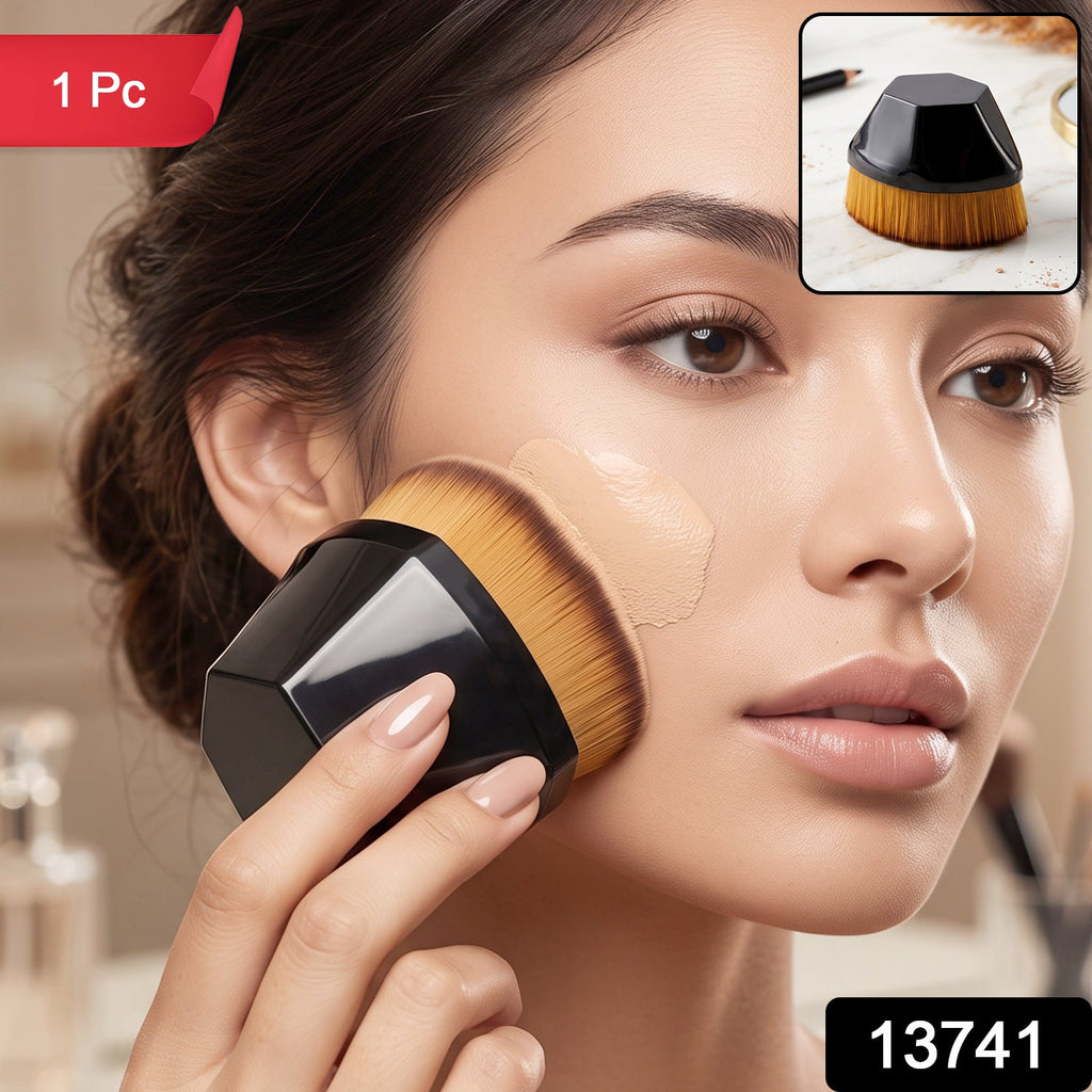 Foundation makeup brush with golden bristles and black hex handle, applying foundation