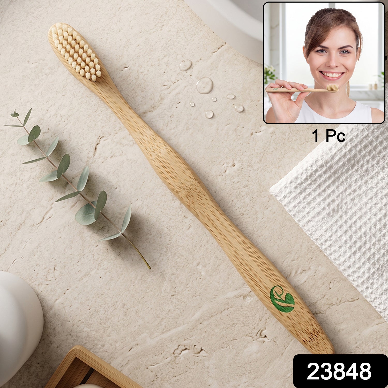 Natural bamboo toothbrush with soft bristle head and green leaf emblem on handle